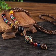 Charger l'image dans la galerie, LONG PENDENTIF ET COLLIER PERLÉS EN BOIS DE MALA