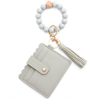 Porte-cartes avec bracelet porte-clés à perles et pompon