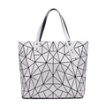 SAC À MAIN À CARREAUX GEOMETRIQUE PLIÉ