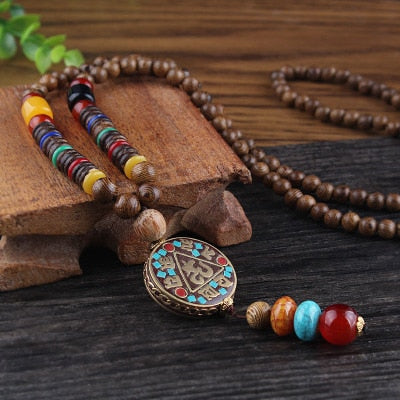 LONG PENDENTIF ET COLLIER PERLÉS EN BOIS DE MALA