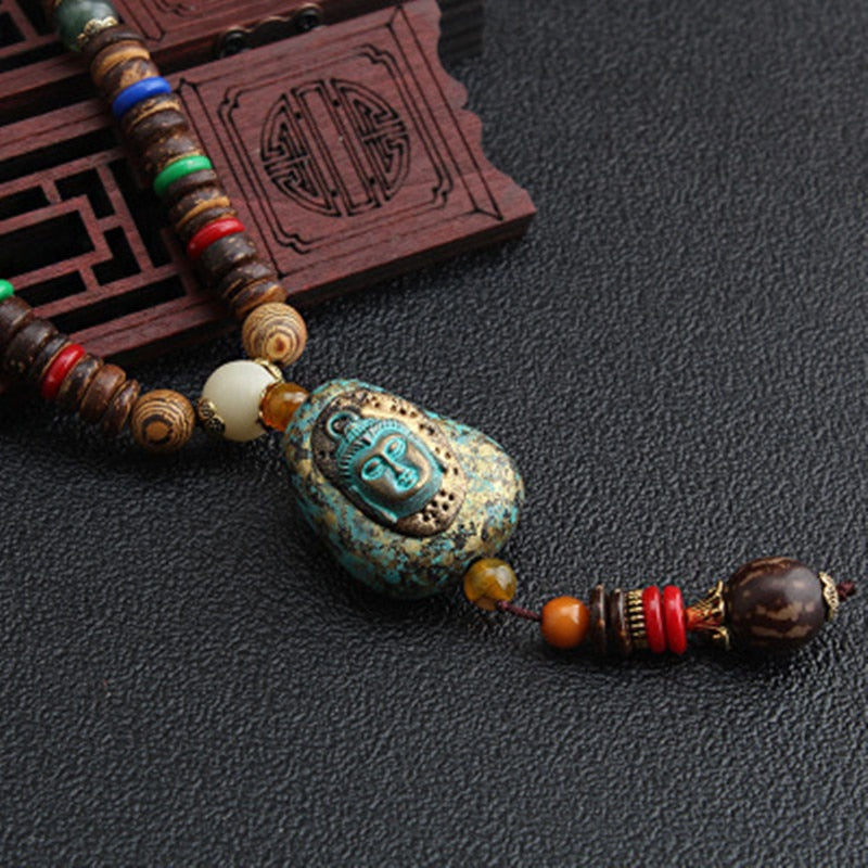 LONG PENDENTIF ET COLLIER PERLÉS EN BOIS DE MALA