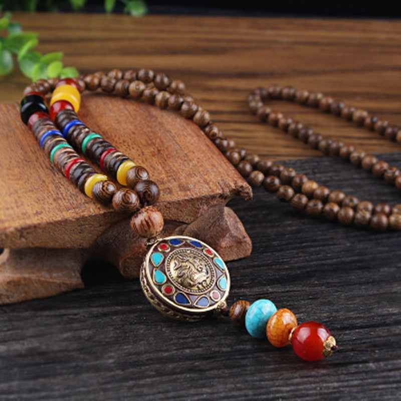 LONG PENDENTIF ET COLLIER PERLÉS EN BOIS DE MALA