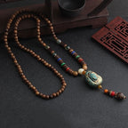 LONG PENDENTIF ET COLLIER PERLÉS EN BOIS DE MALA