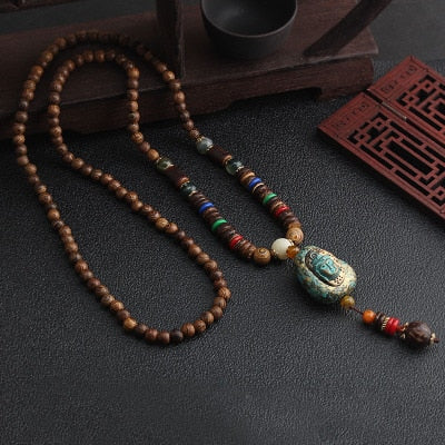 LONG PENDENTIF ET COLLIER PERLÉS EN BOIS DE MALA