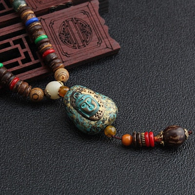 LONG PENDENTIF ET COLLIER PERLÉS EN BOIS DE MALA