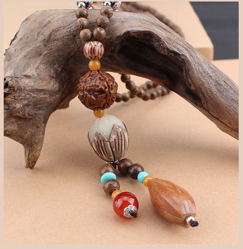 LONG PENDENTIF ET COLLIER PERLÉS EN BOIS DE MALA